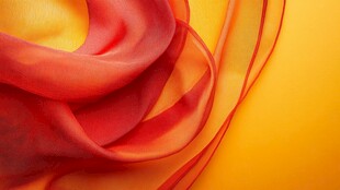 红色绸带于黄色背景舞动