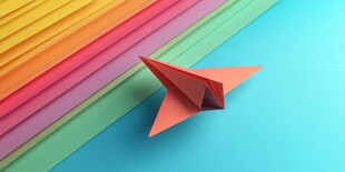 彩色纸间的红色纸飞机