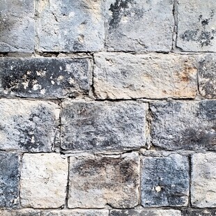 古朴石砖墙纹理特写