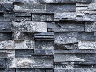 灰黑色石砌墙面纹理特写