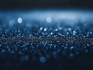 梦幻蓝色光斑粒子背景图