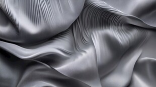 银灰色丝绸的优雅褶皱纹理