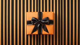 橙色礼盒配黑色蝴蝶结装饰